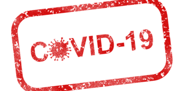 COVID-19 in roter Schrift mit roten Rahmen